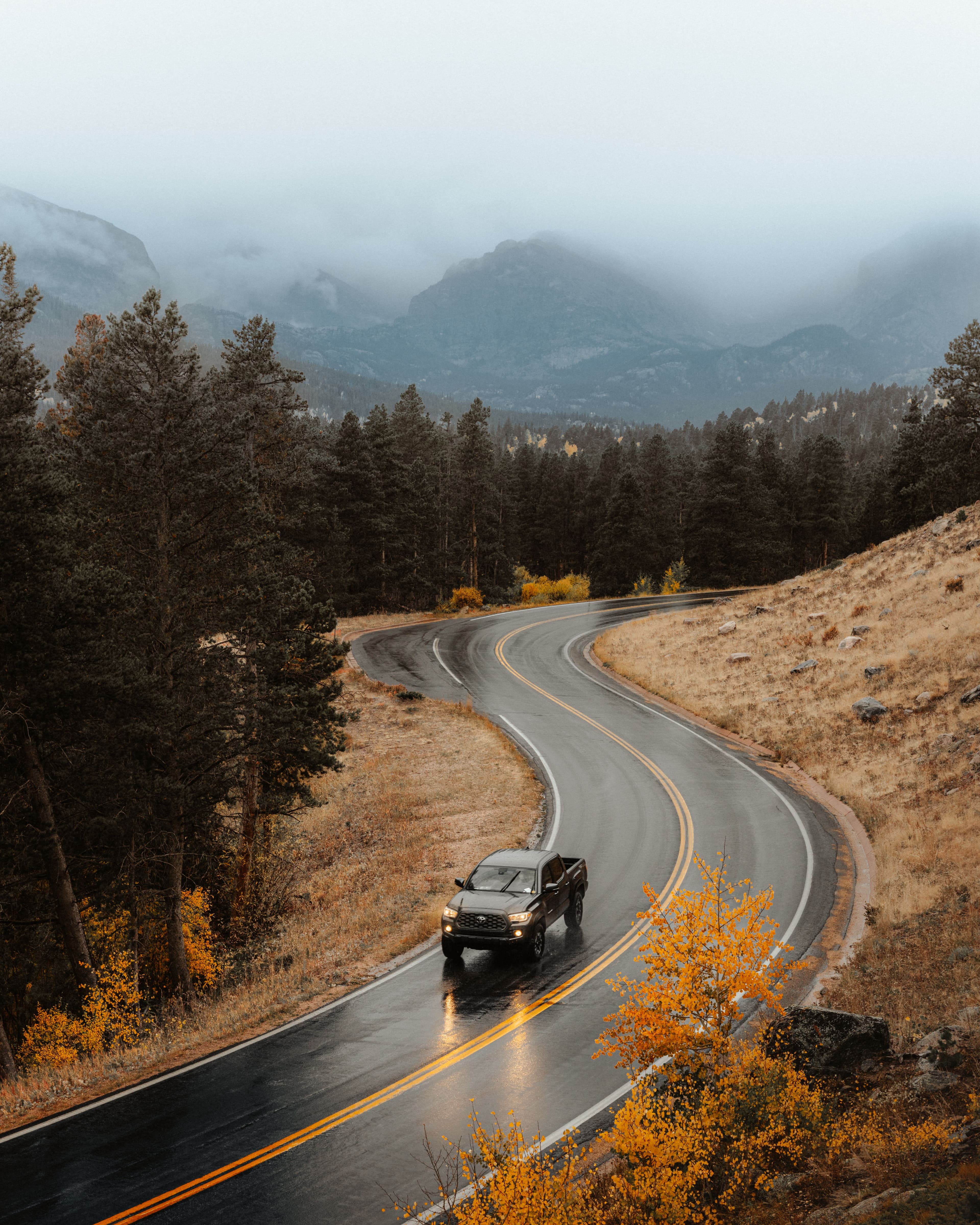 A car driving along a winding mountain road