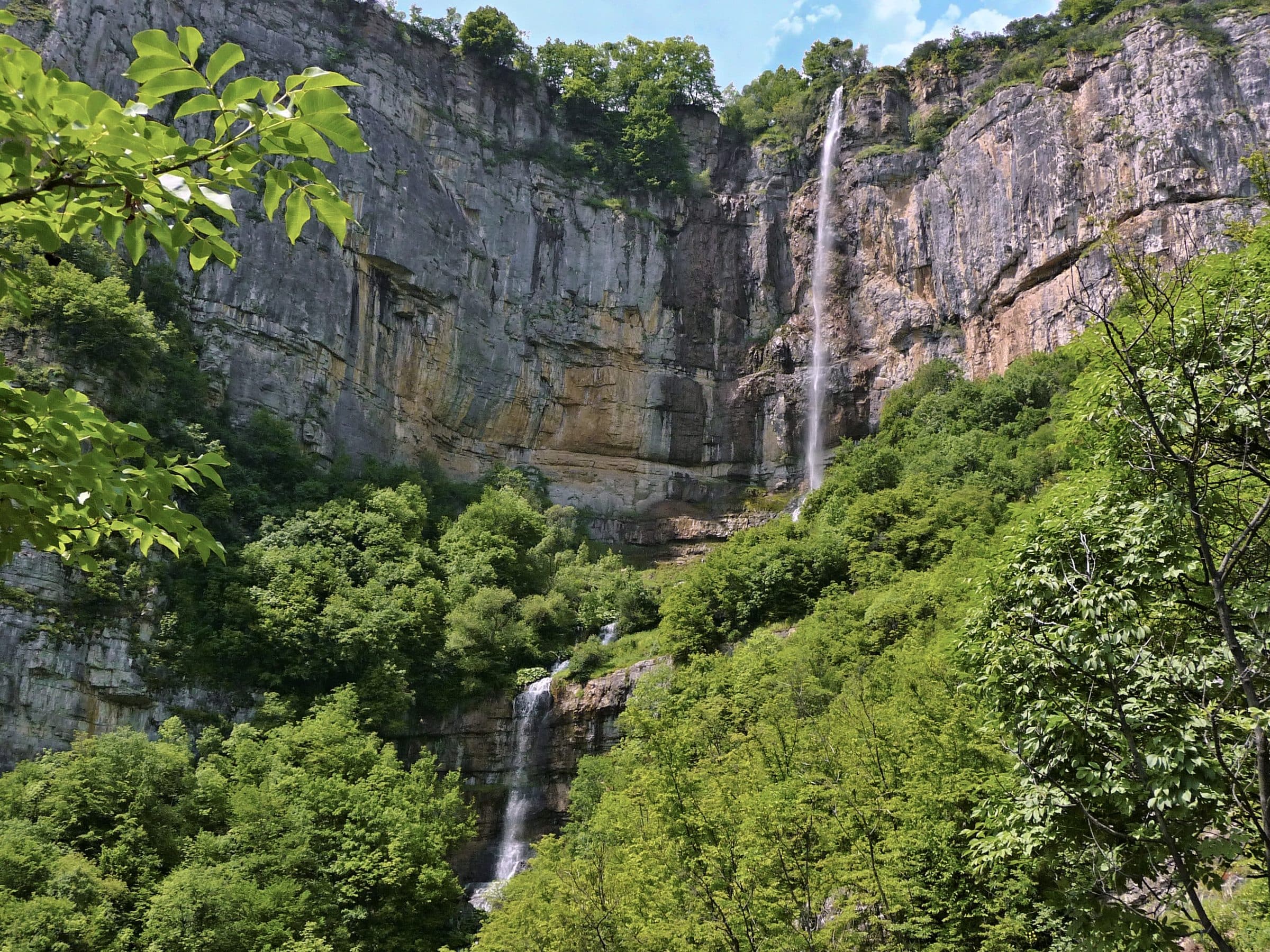 The Skaklya waterfall dropping through a forested limestone gorge near Bov village, Bulgaria