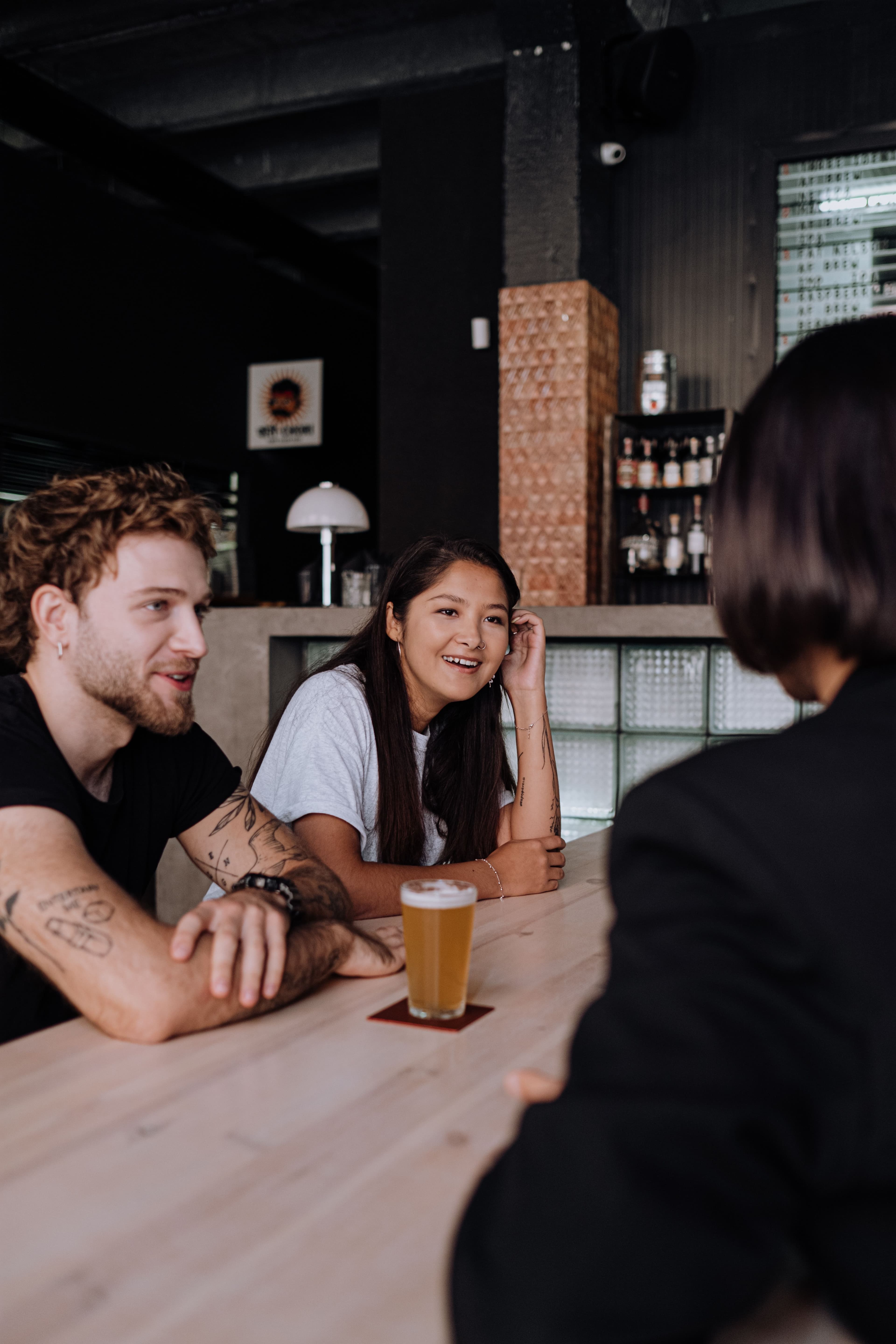 People sitting together at a bar counter during an evening out